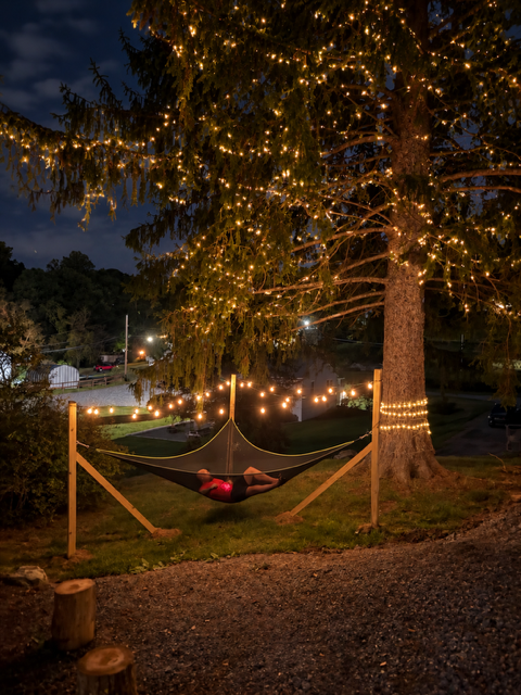 Hammock strung between wooden posts at dusk