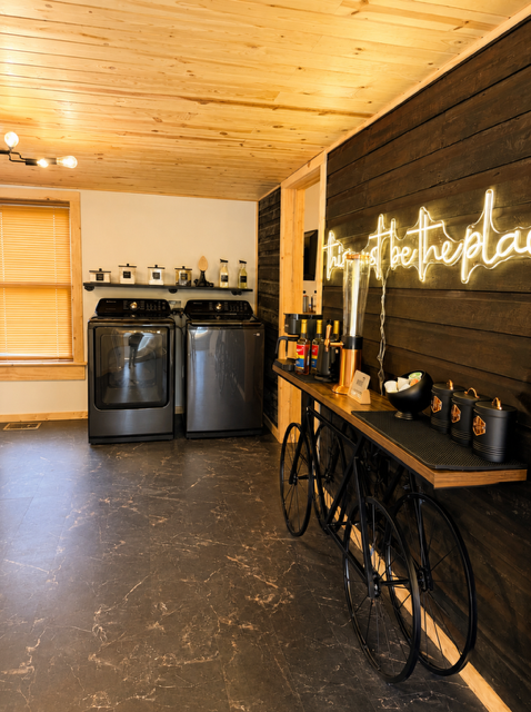 Modern laundry room with neon sign
