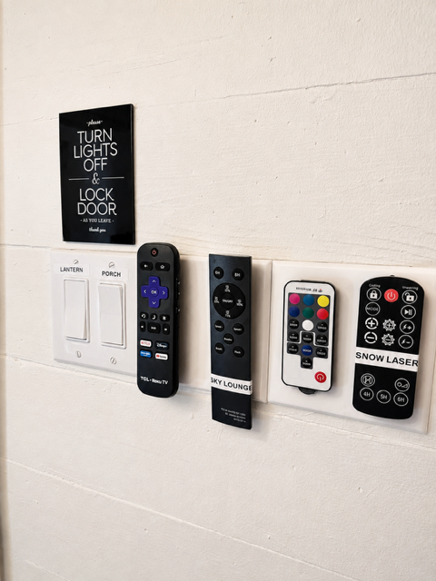 Collection of remote controls wall mounted