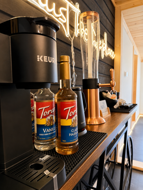Coffee bar — Keurig machine and neon sign