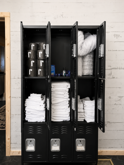 Guest essentials locker stocked with towels and supplies