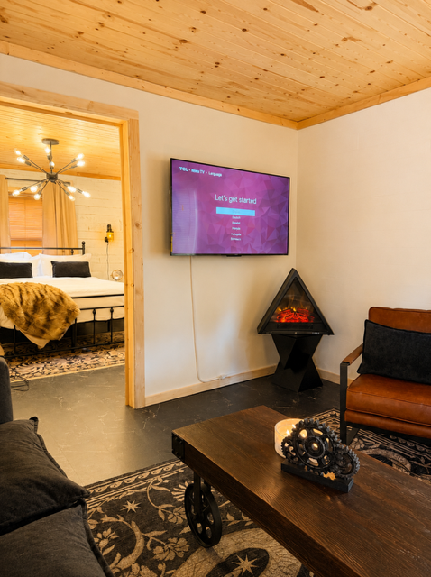 Living area — wall-mounted TV and modern seating