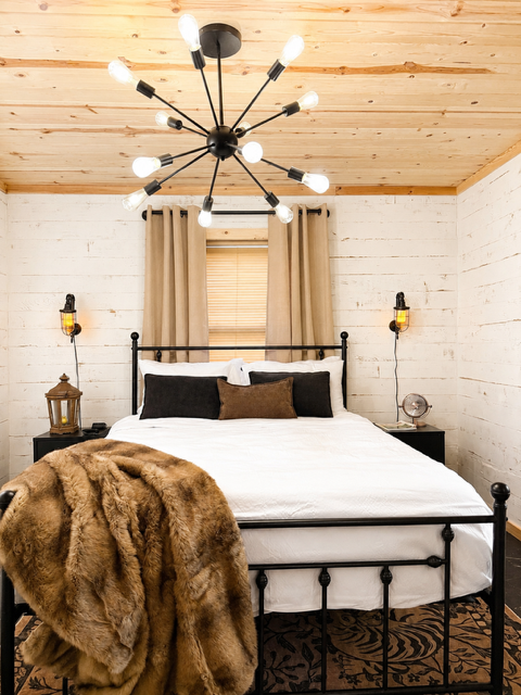 Queen Suite — bedroom with sputnik ceiling light